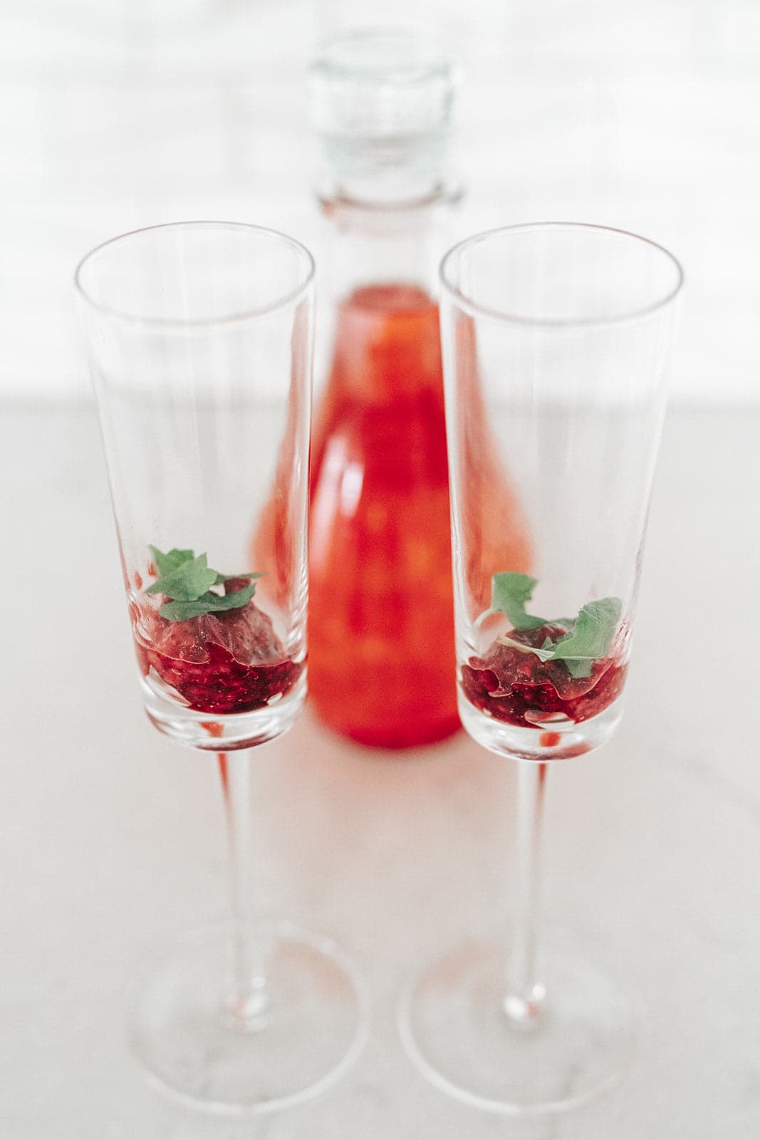Showing Pomegranate in a Glass while having Cannabis Products